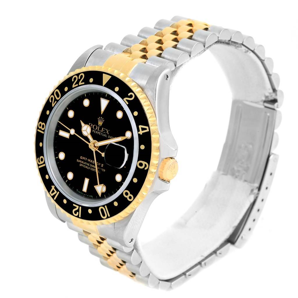 The image shows a Rolex GMT-Master 16713 Men's Stainless Steel Black Dial 16713 Men's Stainless Steel Black Dial watch in a side-angle view, displaying its dial, bezel, and two-tone bracelet.