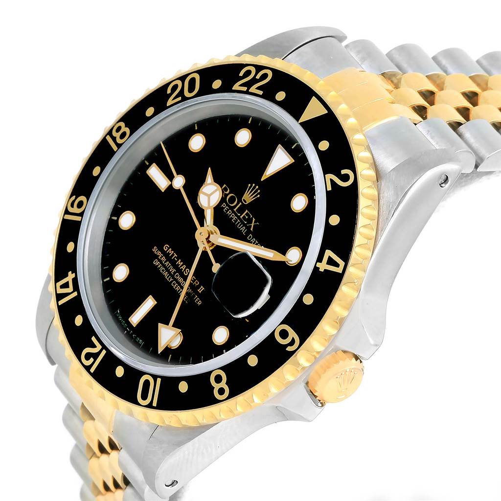 The Rolex GMT-Master 16713 Men's Stainless Steel Black Dial 16713 Men's Stainless Steel Black Dial watch is shown from an angled view, highlighting the bezel, crown, face, and two-tone bracelet.