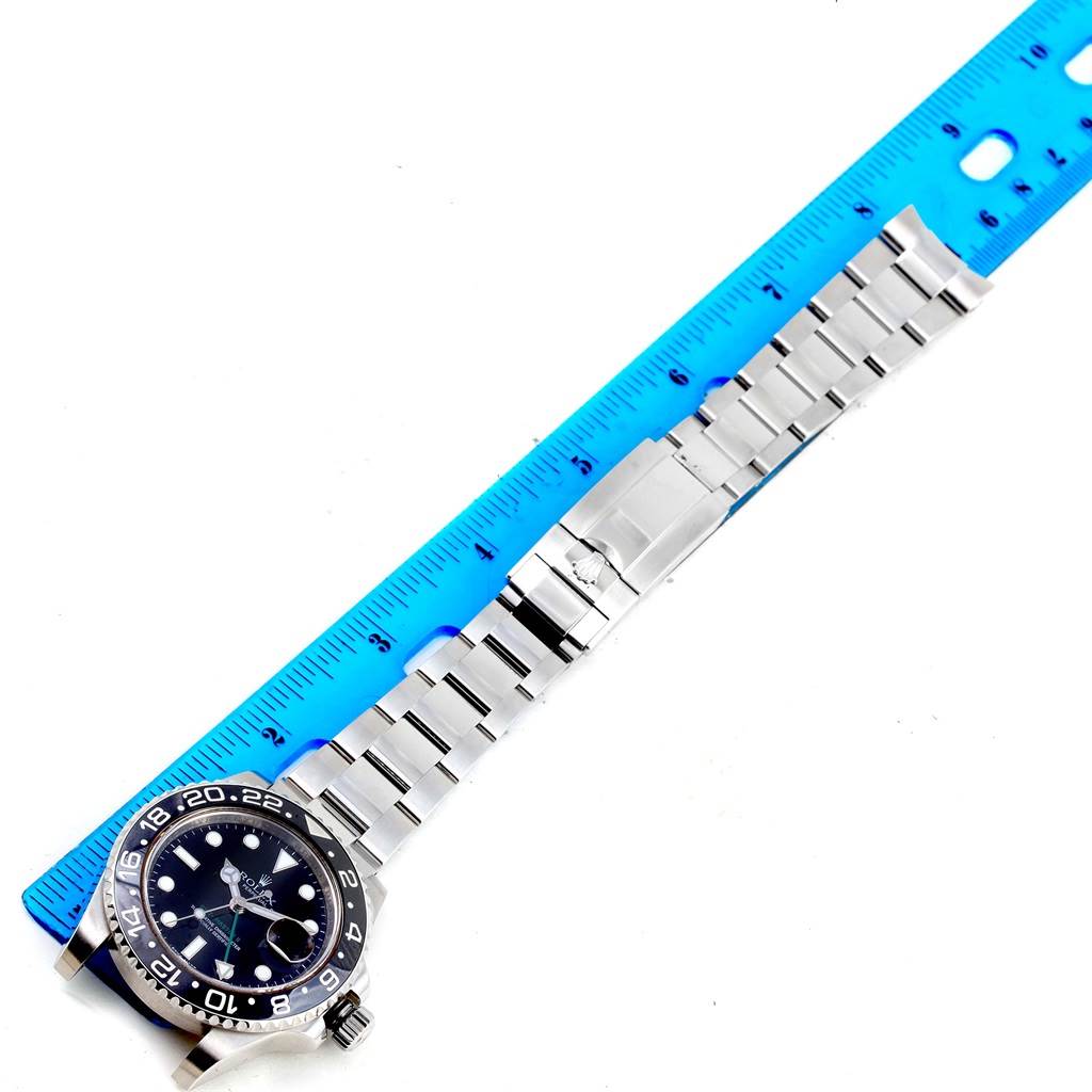 The image shows a Rolex GMT-Master 116710 Men's Stainless Steel Black Dial 116710 Men's Stainless Steel Black Dial watch laid flat, positioned next to a ruler for measurement.