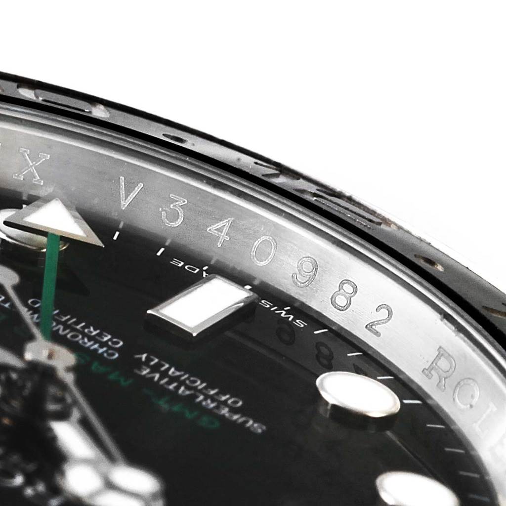 This image shows a close-up of the rehaut and part of the dial of a Rolex GMT-Master 116710 Men's Stainless Steel Black Dial 116710 Men's Stainless Steel Black Dial watch.