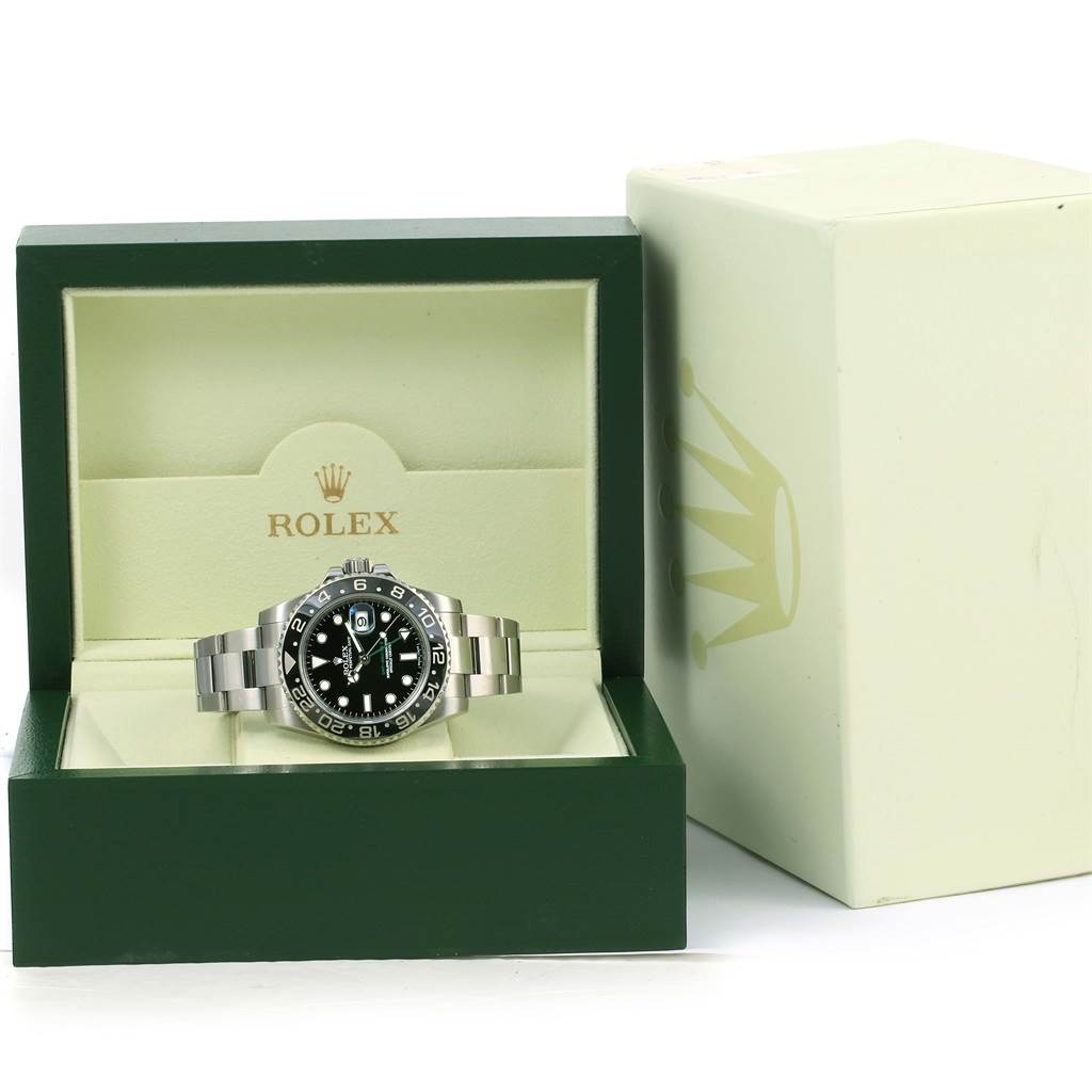 A Rolex GMT-Master 116710 Men
s Stainless Steel Black Dial 116710 Men
s Stainless Steel Black Dial watch is shown from the front inside an open, green box with the brand name and logo visible.