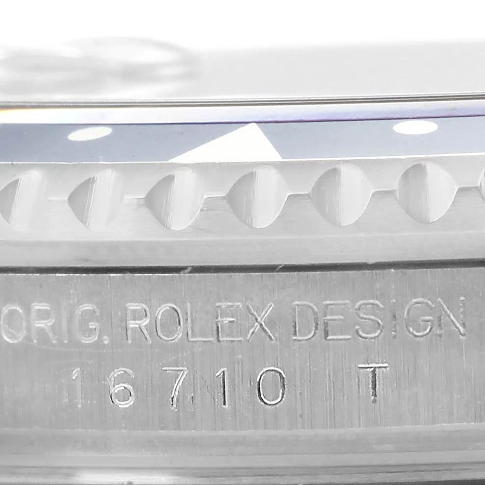 Close-up of the side of a Rolex GMT-Master 16710 Men's Stainless Steel Black Dial 16710 Men's Stainless Steel Black Dial watch showing the model number 16710 and part of the bezel and design engraving.