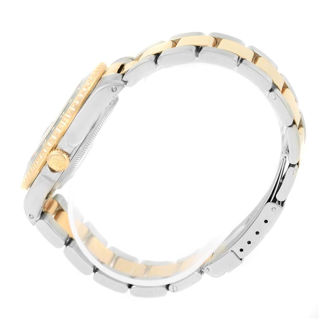 This image shows a side angle of the Rolex GMT-Master 16713 Men's Stainless Steel Black Dial 16713 Men's Stainless Steel Black Dial watch, highlighting its crown and bracelet.