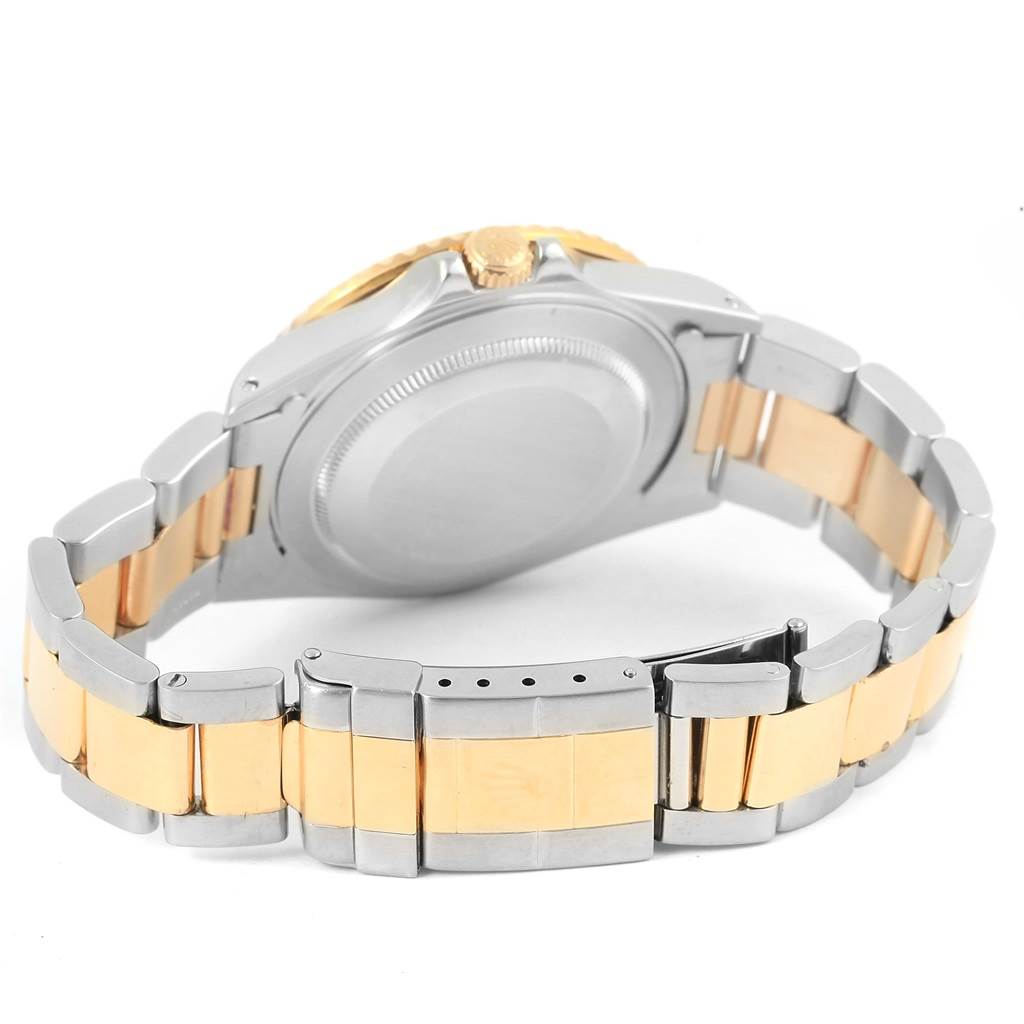 The image shows the back of a Rolex GMT-Master 16713 Men's Stainless Steel Black Dial 16713 Men's Stainless Steel Black Dial watch, highlighting its two-tone bracelet and clasp.