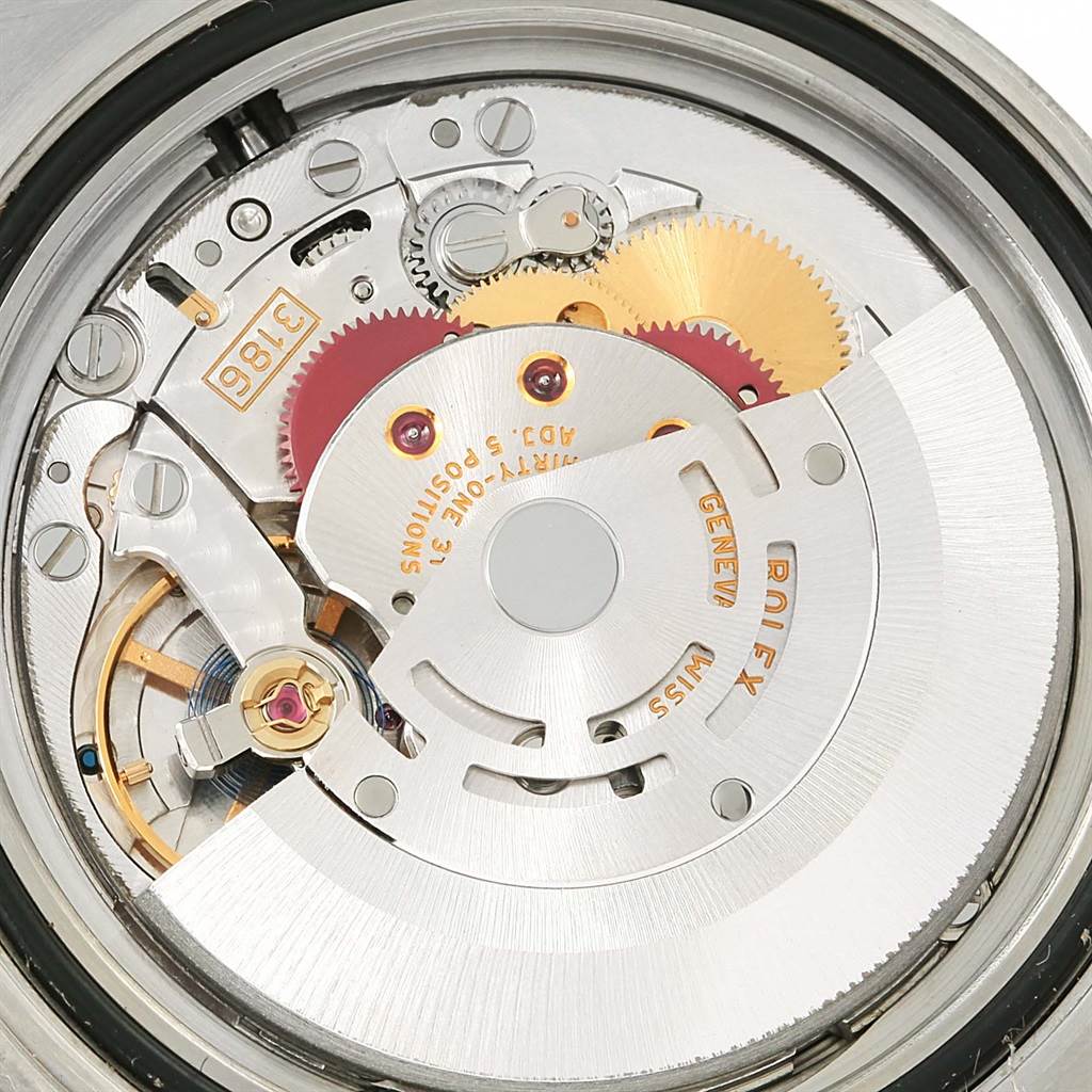 This is a close-up shot of the movement mechanism of a Rolex GMT-Master 116710 Men's Stainless Steel Black Dial 116710 Men's Stainless Steel Black Dial watch, showcasing gears, screws, and the rotor.