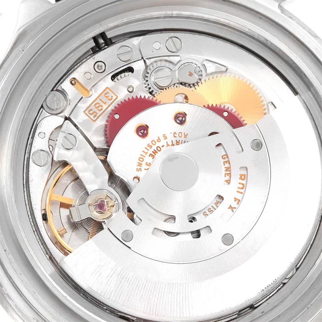 This image shows the internal movement mechanism of a Rolex GMT-Master 16710 Men
s Stainless Steel Black Dial 16710 Men
s Stainless Steel Black Dial watch from a low angle, revealing gears and intricate components.