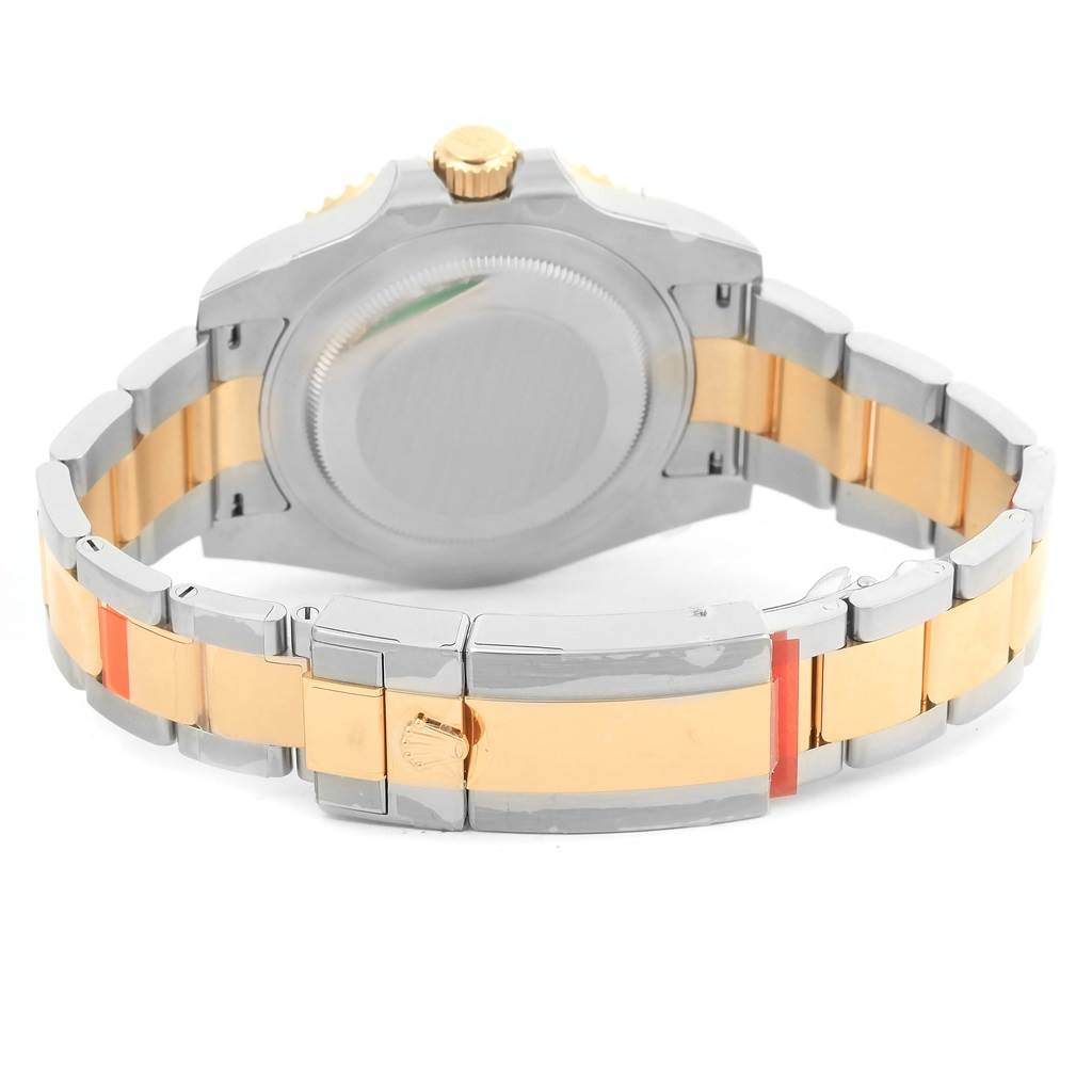 The image shows the back view of a Rolex GMT-Master 116713 Men's Stainless Steel Black Dial 116713 Men's Stainless Steel Black Dial watch, highlighting its two-tone bracelet and clasp.