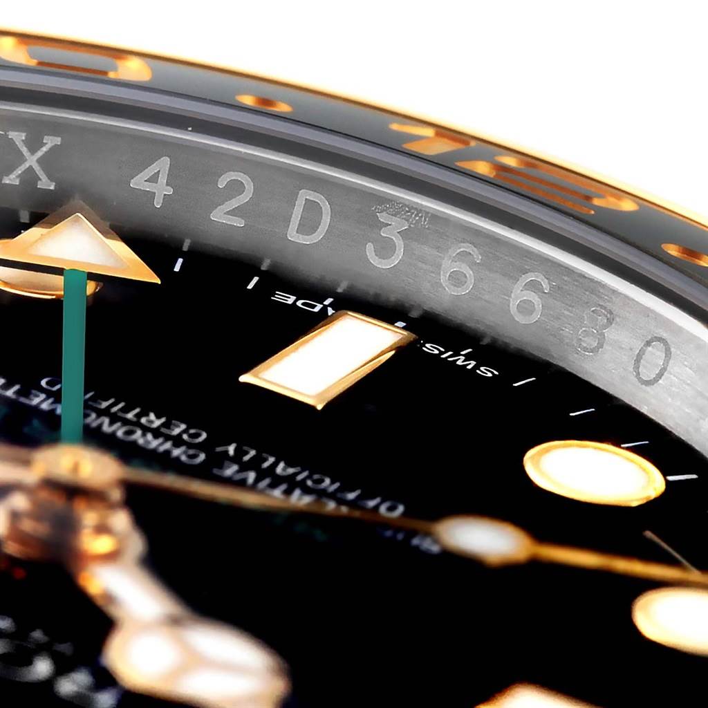 The image shows a close-up angle of a Rolex GMT-Master 116713 Men's Stainless Steel Black Dial 116713 Men's Stainless Steel Black Dial watch, focusing on the serial number engraving, dial, and markers.