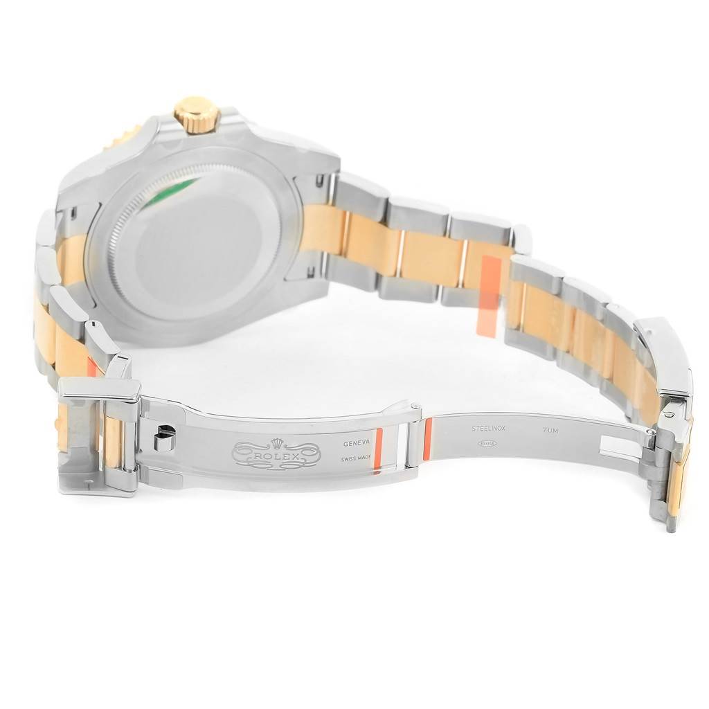 This image shows the open clasp and bracelet of a Rolex GMT-Master 116713 Men's Stainless Steel Black Dial 116713 Men's Stainless Steel Black Dial watch, highlighting the two-tone band.