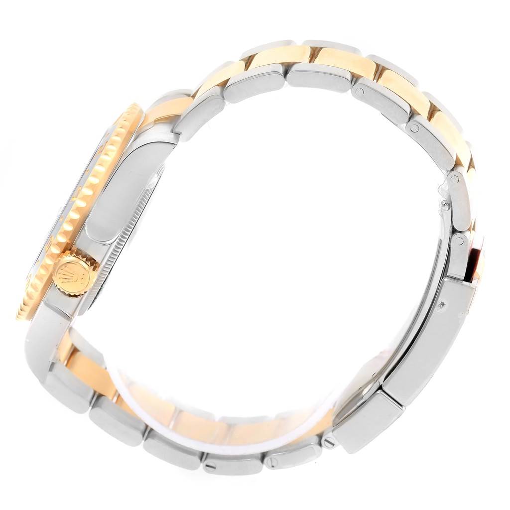 The image shows a side profile of the Rolex GMT-Master 116713 Men's Stainless Steel Black Dial 116713 Men's Stainless Steel Black Dial watch, highlighting the crown, bezel, and two-tone bracelet.