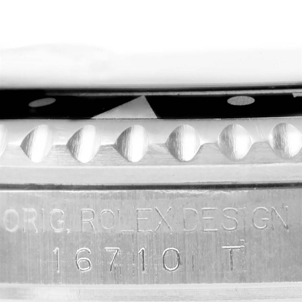 The image shows a close-up side view of the bezel and case of the Rolex GMT-Master 16710 Men's Stainless Steel Black Dial 16710 Men's Stainless Steel Black Dial, featuring the model number 16710 T.