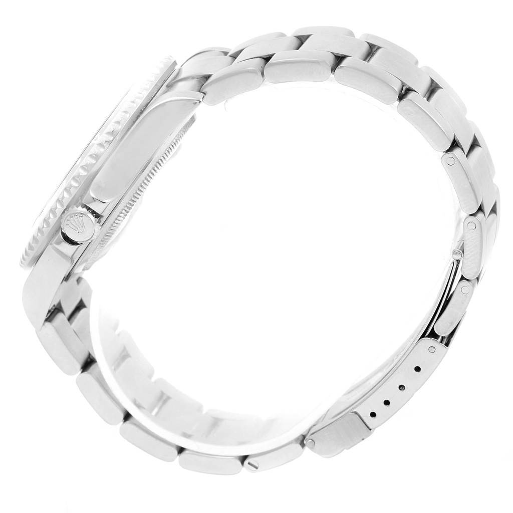 This side view of the Rolex GMT-Master 16710 Men's Stainless Steel Black Dial 16710 Men's Stainless Steel Black Dial watch showcases the wristband and crown.