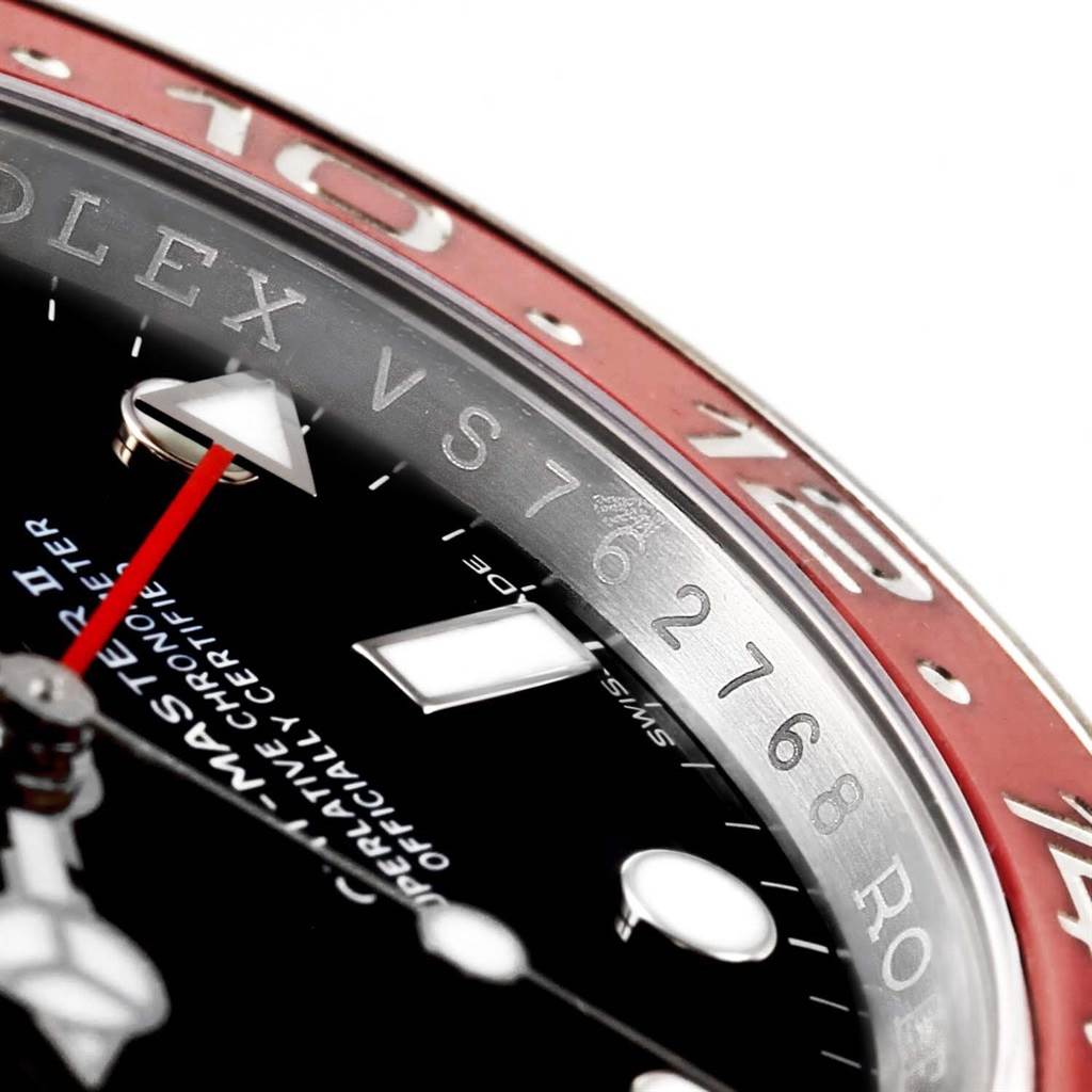 This image shows a close-up of the Rolex GMT-Master 116719 Men
s White Gold Black Dial 116719 Men
s White Gold Black Dial watch, highlighting the dial, bezel, and partial serial number.