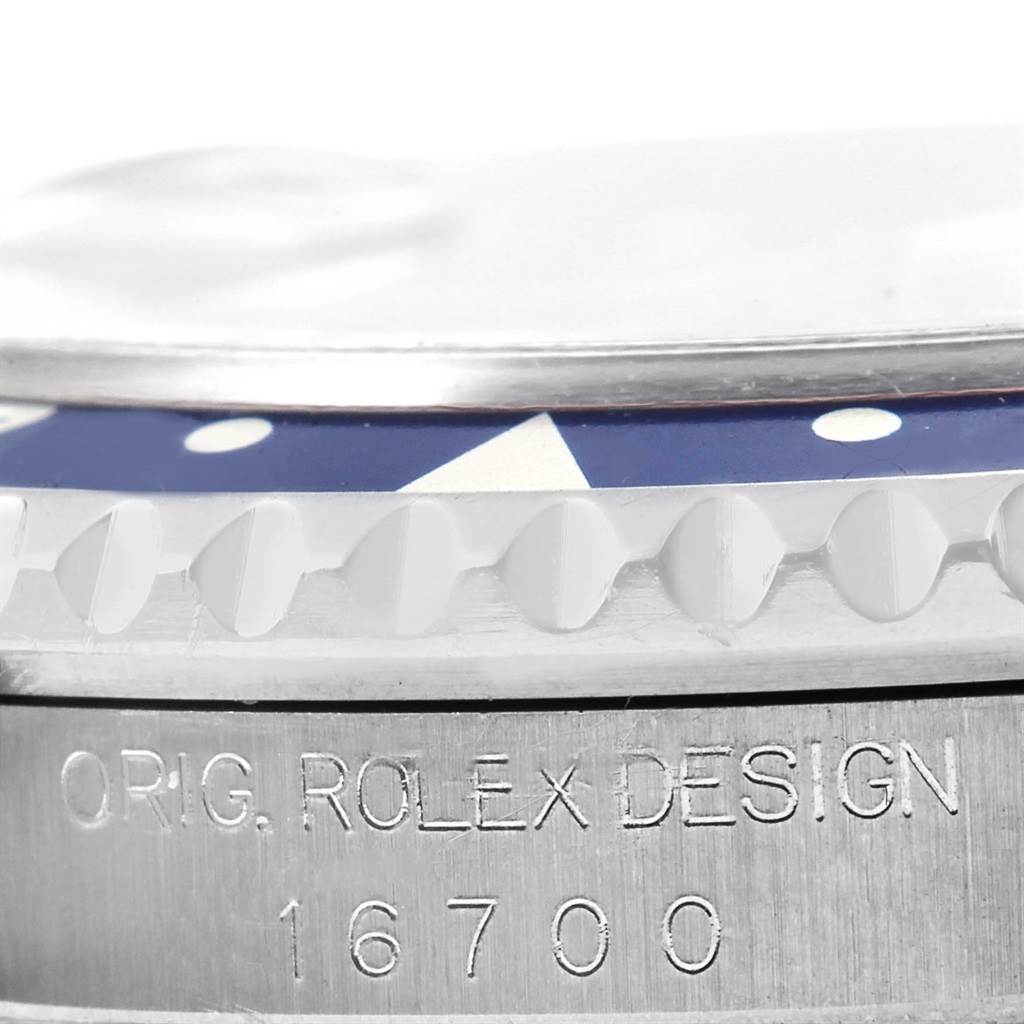 This angle shows a close-up of the case side and bezel of the Rolex GMT-Master 16700 Men's Stainless Steel Black Dial 16700 Men's Stainless Steel Black Dial with the model number 16700.