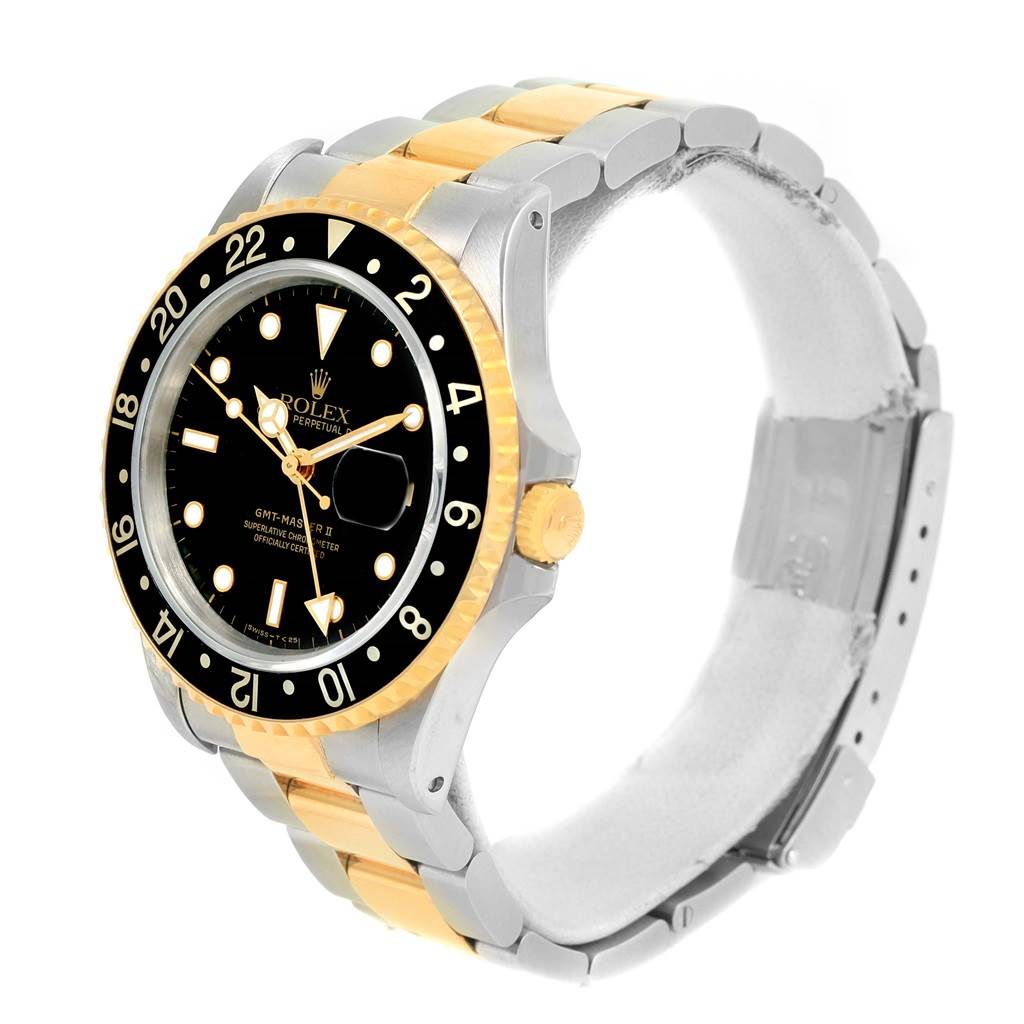 This image shows a side view of a Rolex GMT-Master 16713 Men's Stainless Steel Black Dial 16713 Men's Stainless Steel Black Dial watch, highlighting the bezel, dial, and two-tone bracelet.