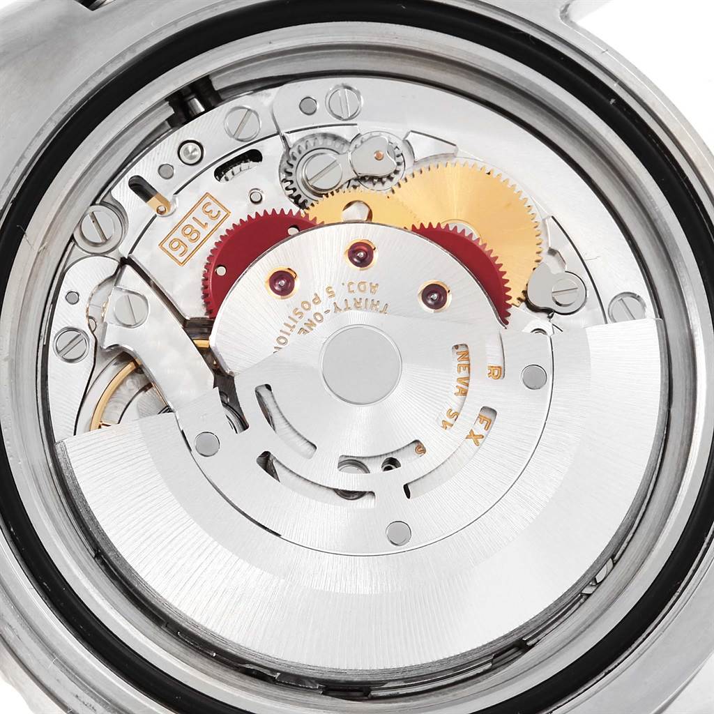 This close-up image showcases the movement mechanism and inner workings of a Rolex GMT-Master 116710 Men's Stainless Steel Black Dial 116710 Men's Stainless Steel Black Dial watch.