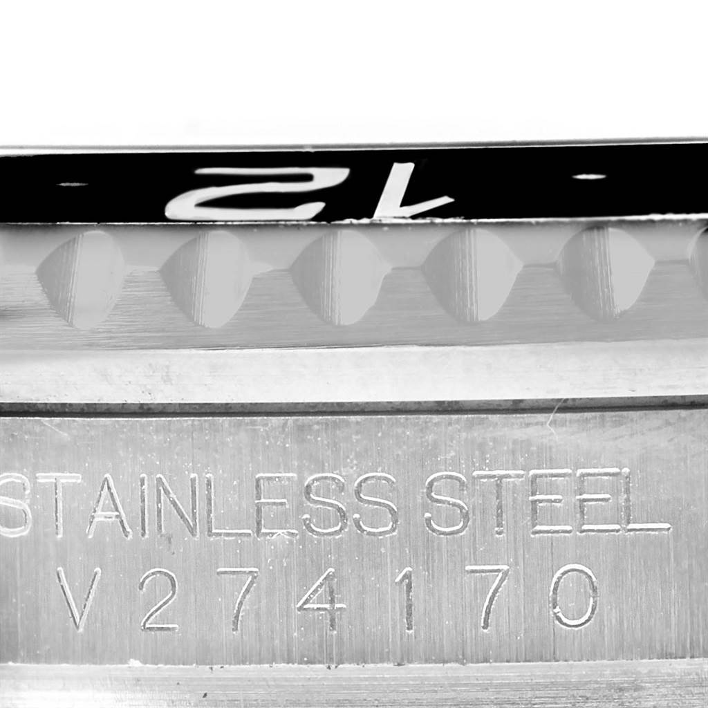 This image shows the side view of the bezel and the serial number engraving on a stainless steel Rolex GMT-Master 116710 Men's Stainless Steel Black Dial 116710 Men's Stainless Steel Black Dial watch.