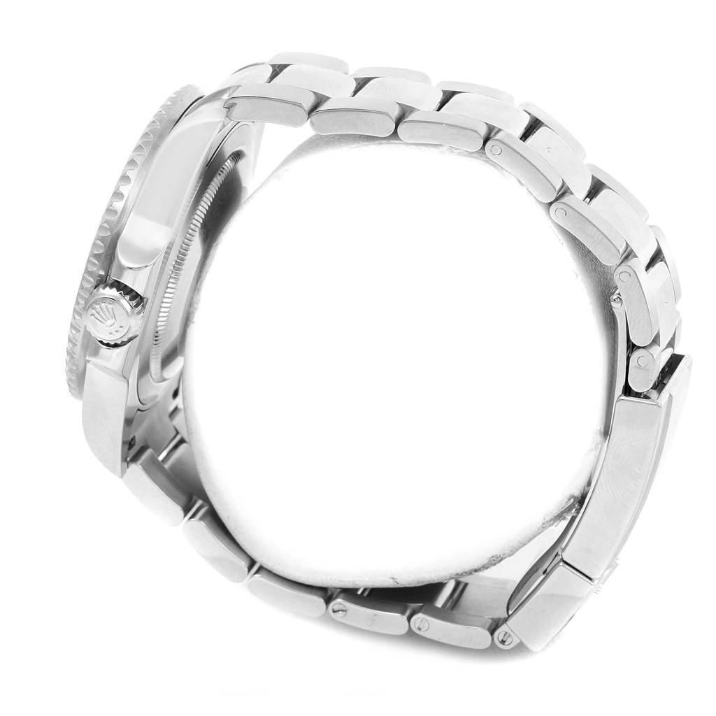 This side view of the Rolex GMT-Master 116710 Men's Stainless Steel Black Dial 116710 Men's Stainless Steel Black Dial watch showcases the case, crown, and bracelet links.