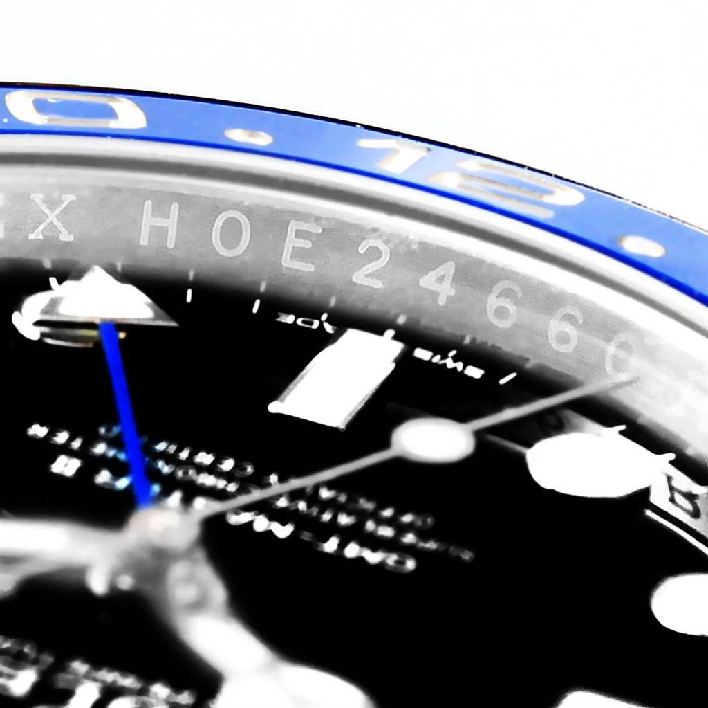 This close-up angle of the Rolex GMT-Master 116710 Men's Stainless Steel Black Dial 116710 Men's Stainless Steel Black Dial watch shows the bezel, part of the face, and the hour and minute hands.