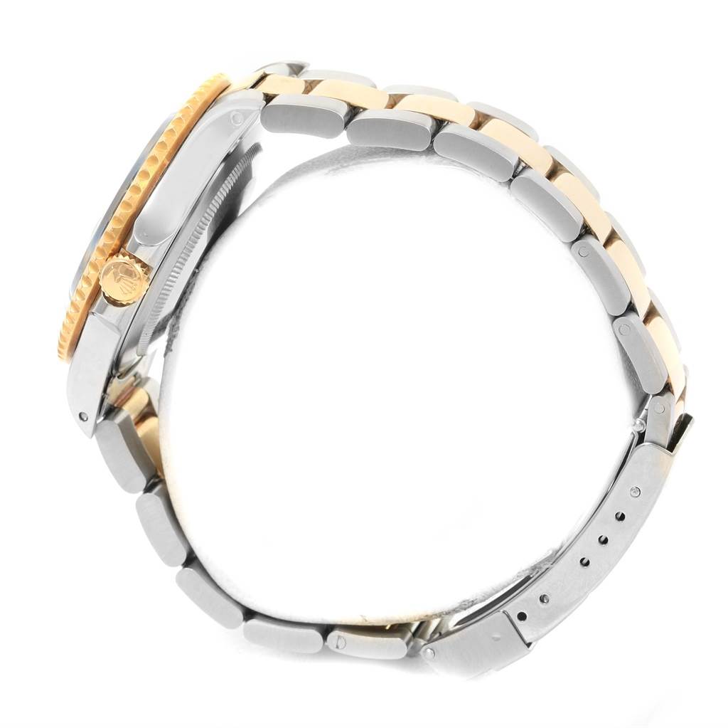 The image shows a side view of a Rolex GMT-Master 16713 Men's Stainless Steel Black Dial 16713 Men's Stainless Steel Black Dial watch, highlighting its bezel, crown, and two-tone bracelet.