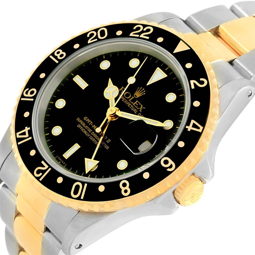 The image shows a close-up, angled view of a Rolex GMT-Master 16713 Men's Stainless Steel Black Dial 16713 Men's Stainless Steel Black Dial II watch, highlighting its bezel, dial, and part of the bracelet.