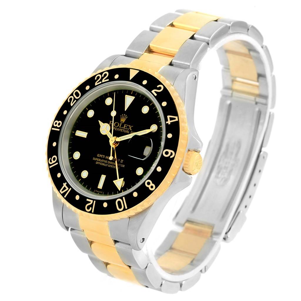 The image shows a Rolex GMT-Master 16713 Men's Stainless Steel Black Dial 16713 Men's Stainless Steel Black Dial watch angled to display the face, bezel, and two-tone bracelet.