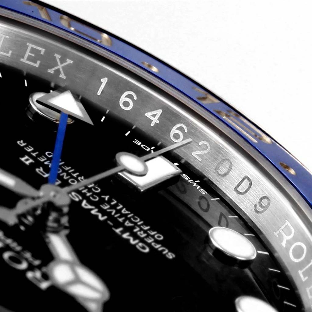 The image shows a close-up view of the GMT-Master Rolex bezel, dial, and part of the GMT hand.