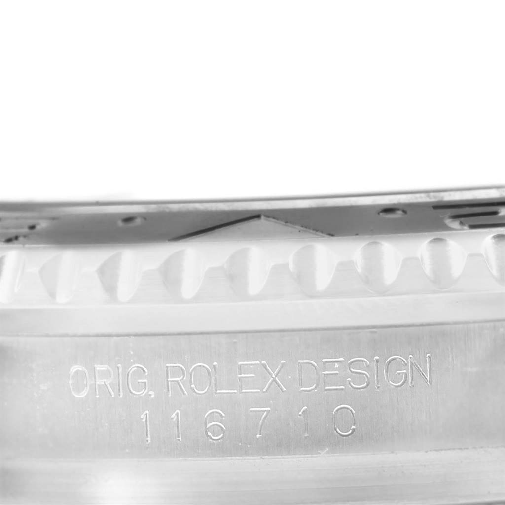 This image shows a close-up view of the case side and bezel of a Rolex GMT-Master 116710 Men's Stainless Steel Black Dial 116710 Men's Stainless Steel Black Dial, focusing on the engraving "ORIG, ROLEX DESIGN 116710."