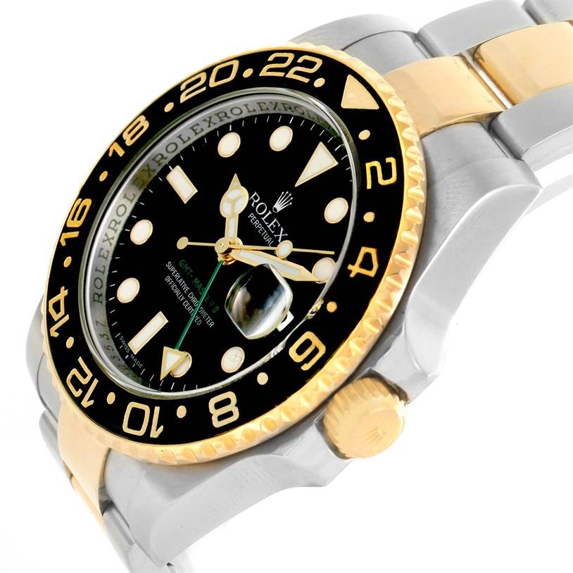 This image shows a close-up of the Rolex GMT-Master 116713 Men's Stainless Steel Black Dial 116713 Men's Stainless Steel Black Dial watch, highlighting the black and gold bezel, dial, and part of the bracelet.