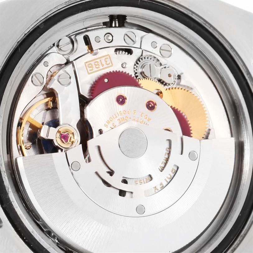 The image shows a close-up of the movement mechanism inside a Rolex GMT-Master 116713 Men's Stainless Steel Black Dial 116713 Men's Stainless Steel Black Dial watch.