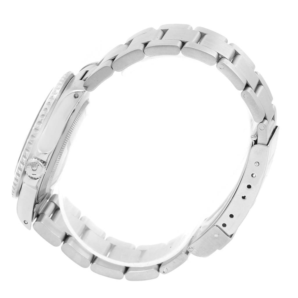 This side-angle view of a Rolex GMT-Master 16710 Men's Stainless Steel Black Dial 16710 Men's Stainless Steel Black Dial shows the case, crown, and part of the bracelet.