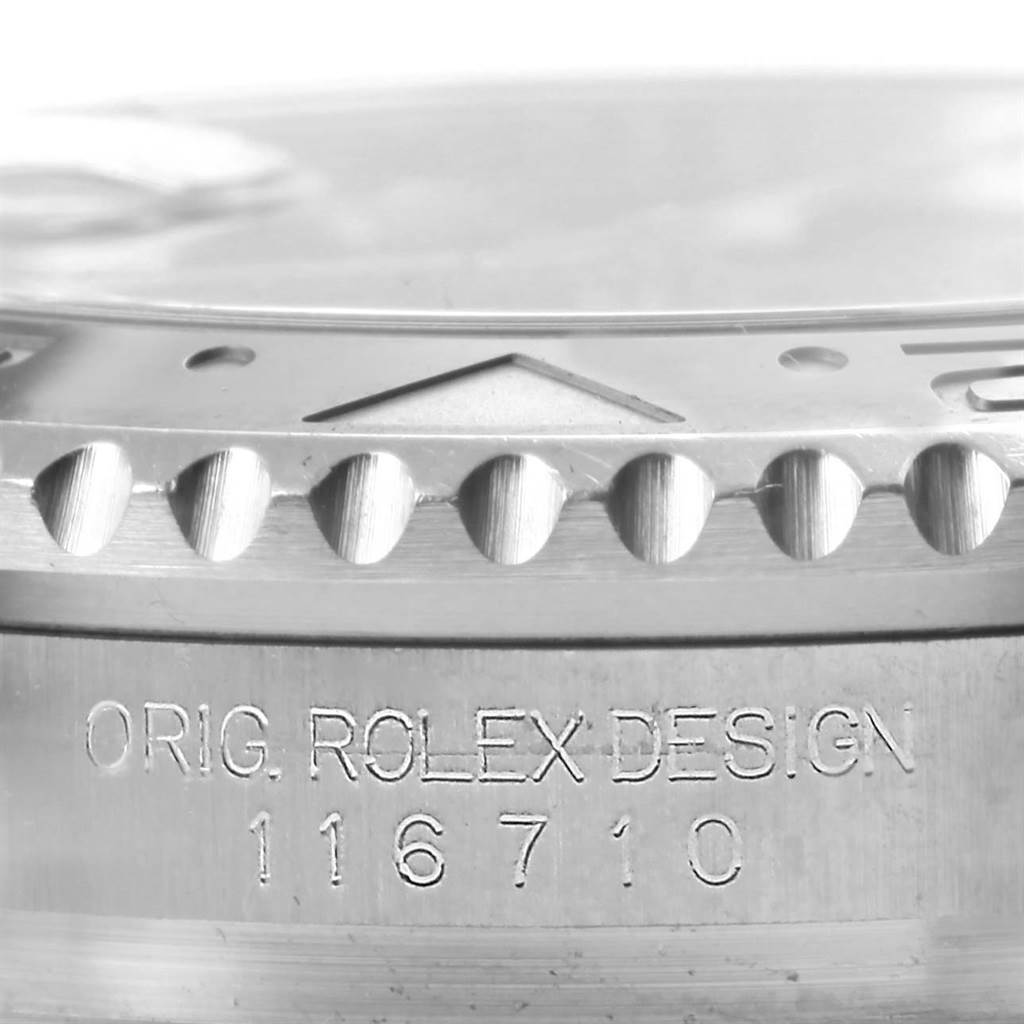 The image shows a close-up angled view of the bezel and case side of a Rolex GMT-Master 116710 Men's Stainless Steel Black Dial 116710 Men's Stainless Steel Black Dial, highlighting the model number and engraving.