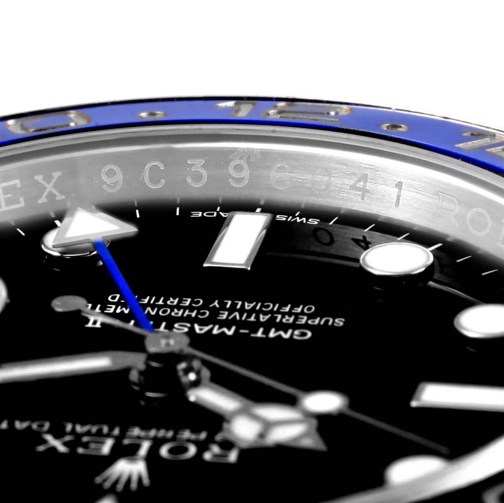 Close-up of the GMT-Master model by Rolex showing the dial, bezel, and part of the engravings.
