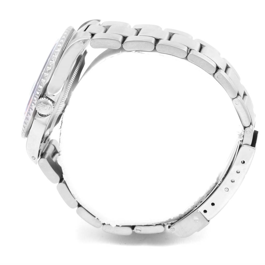 The image shows a side view of the Rolex GMT-Master 16700 Men's Stainless Steel Black Dial 16700 Men's Stainless Steel Black Dial watch, highlighting the bracelet and the crown.