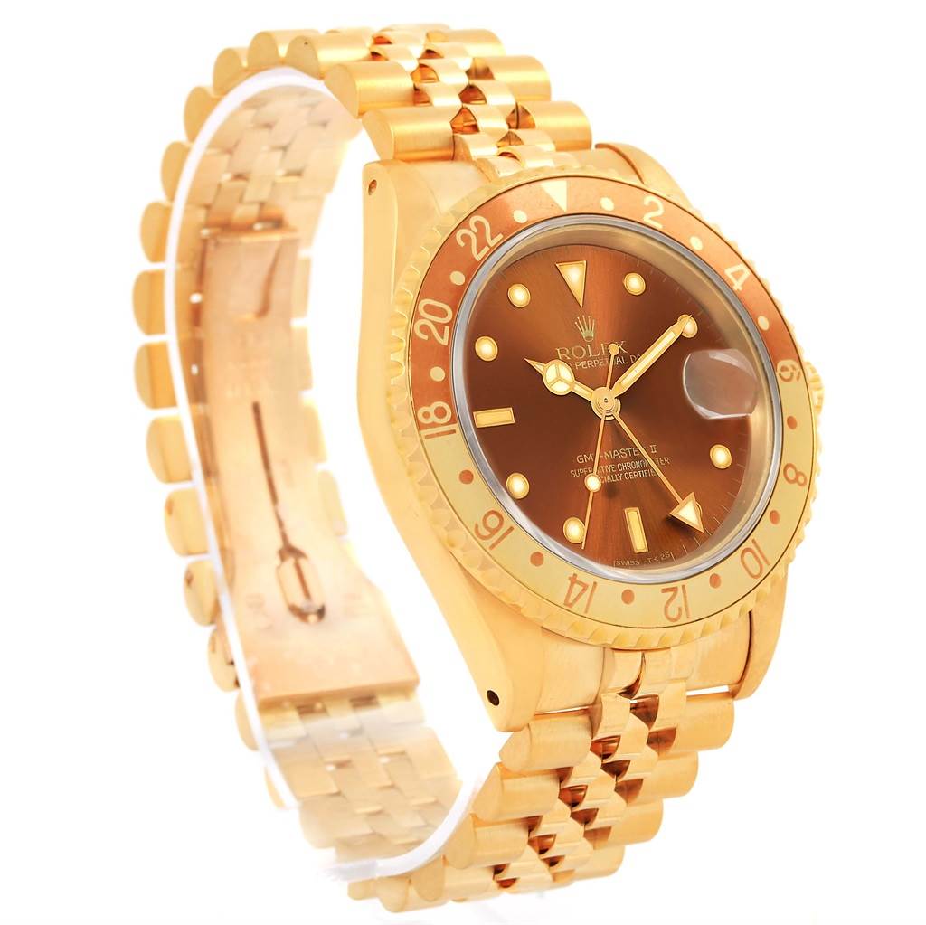 The image shows a side angle of a Rolex GMT-Master 16718 Men's Yellow Gold Brown Dial 16718 Men's Yellow Gold Brown Dial watch, highlighting its gold bracelet, bezel, and brown dial.