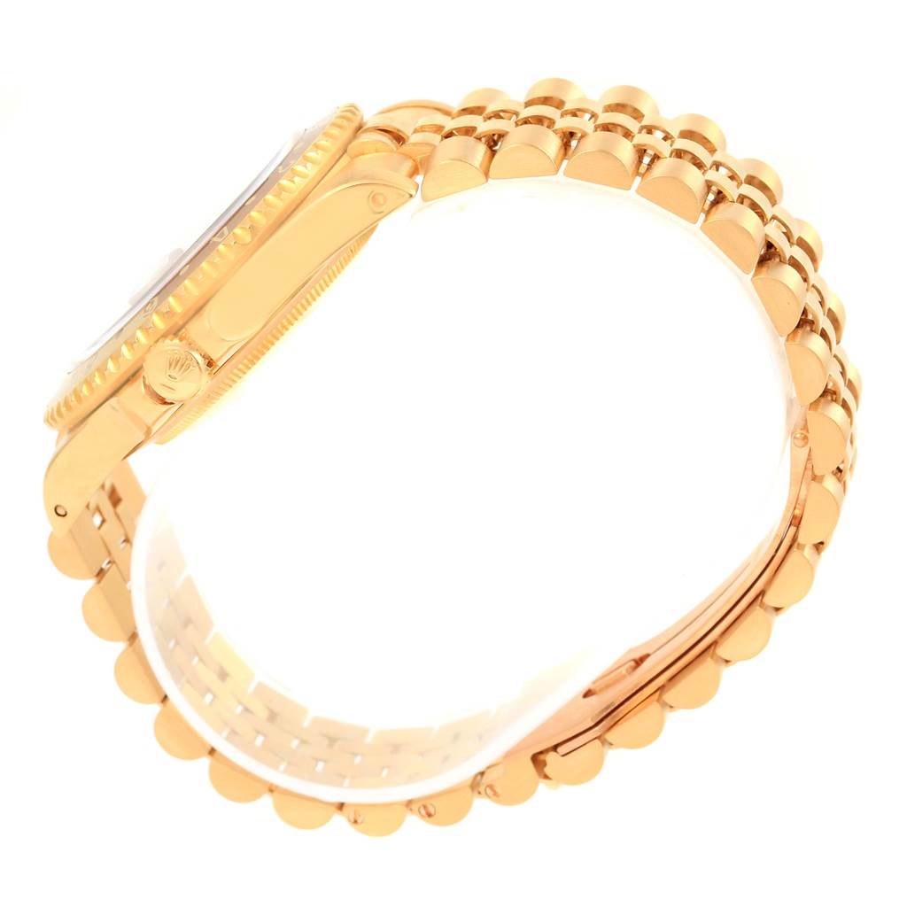 The image shows the side profile of a Rolex GMT-Master 16718 Men's Yellow Gold Brown Dial 16718 Men's Yellow Gold Brown Dial, highlighting its case, crown, and bracelet.