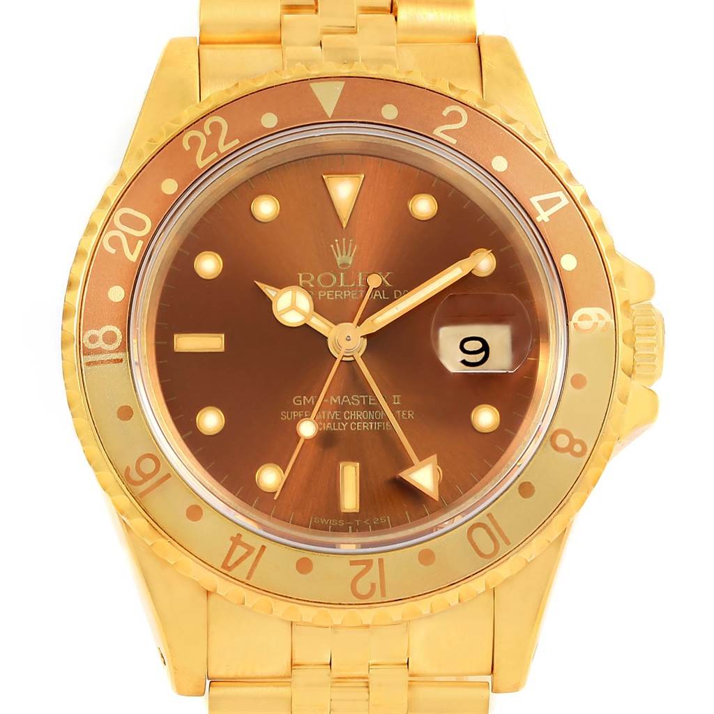 This image shows a Rolex GMT-Master 16718 Men's Yellow Gold Brown Dial 16718 Men's Yellow Gold Brown Dial II watch from a front angle, highlighting its gold case, bezel, and brown dial.