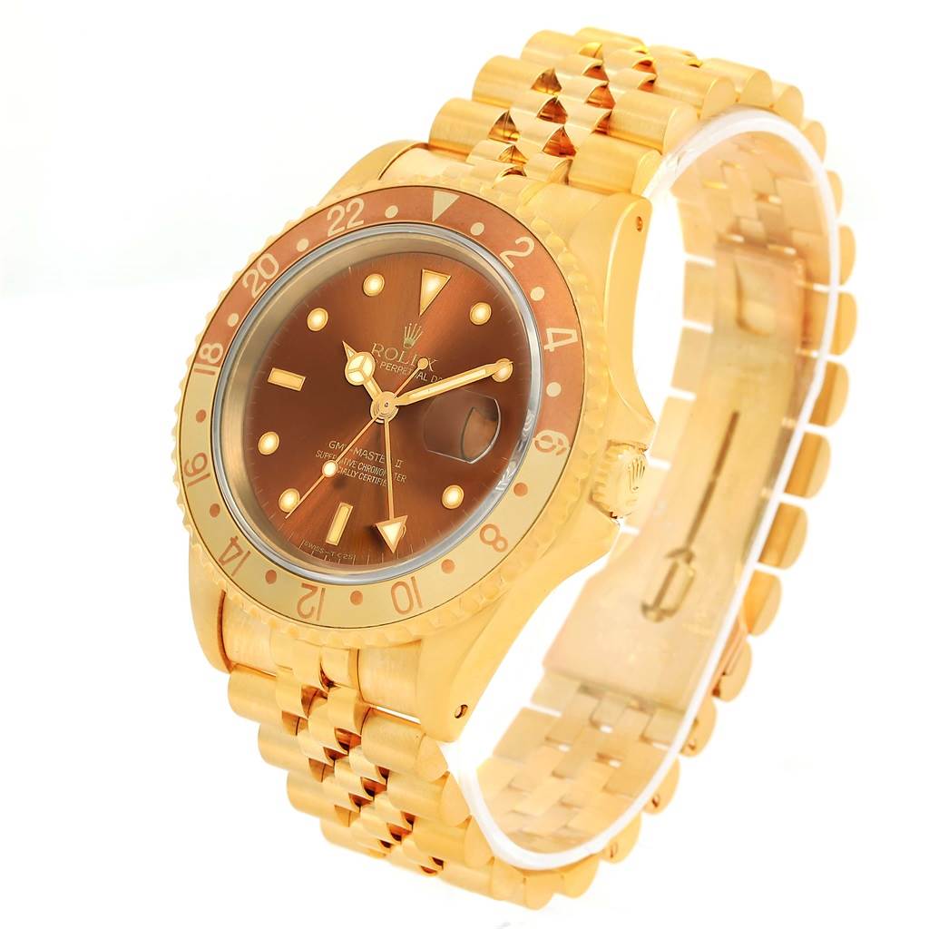 The image shows a Rolex GMT-Master 16718 Men's Yellow Gold Brown Dial 16718 Men's Yellow Gold Brown Dial watch in a side angle, highlighting the dial, bezel, crown, and bracelet.