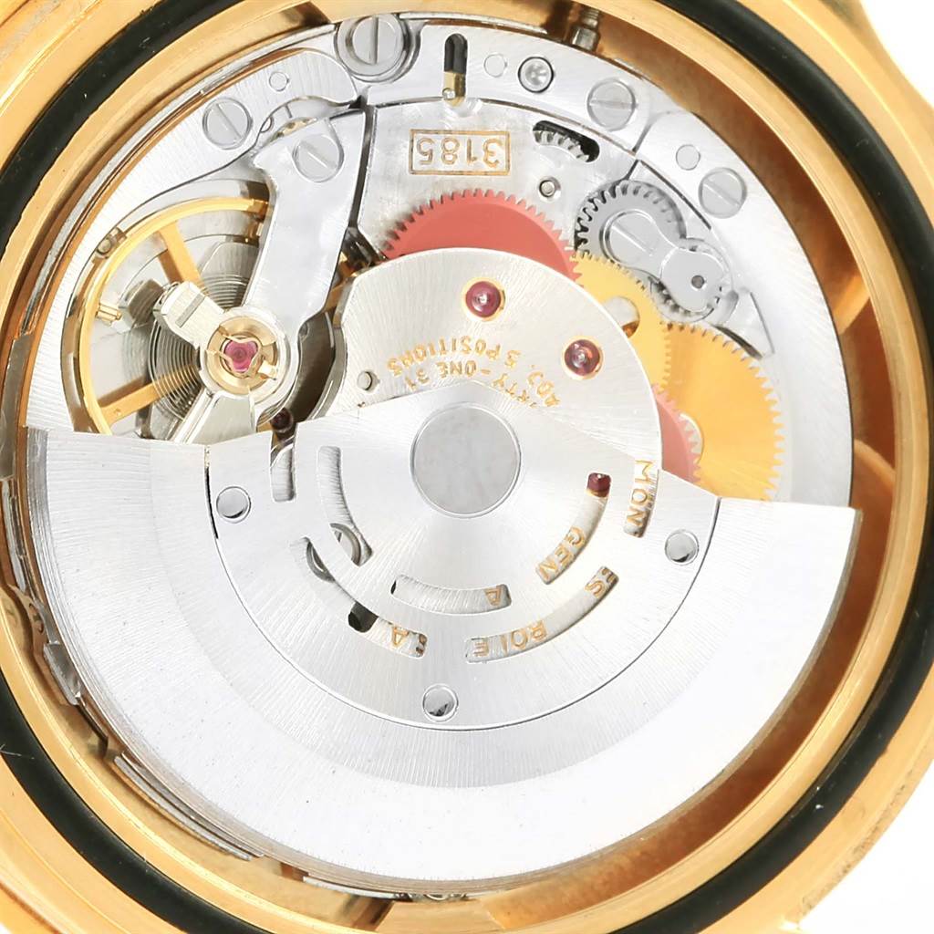 This image shows the movement mechanism of a Rolex GMT-Master 16718 Men's Yellow Gold Brown Dial 16718 Men's Yellow Gold Brown Dial watch from a close-up angle.