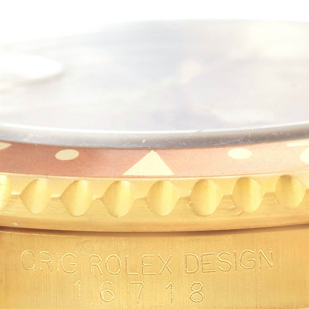 The image shows a close-up of the bezel and side of the case of a Rolex GMT-Master 16718 Men's Yellow Gold Brown Dial 16718 Men's Yellow Gold Brown Dial, highlighting the model number 16718.