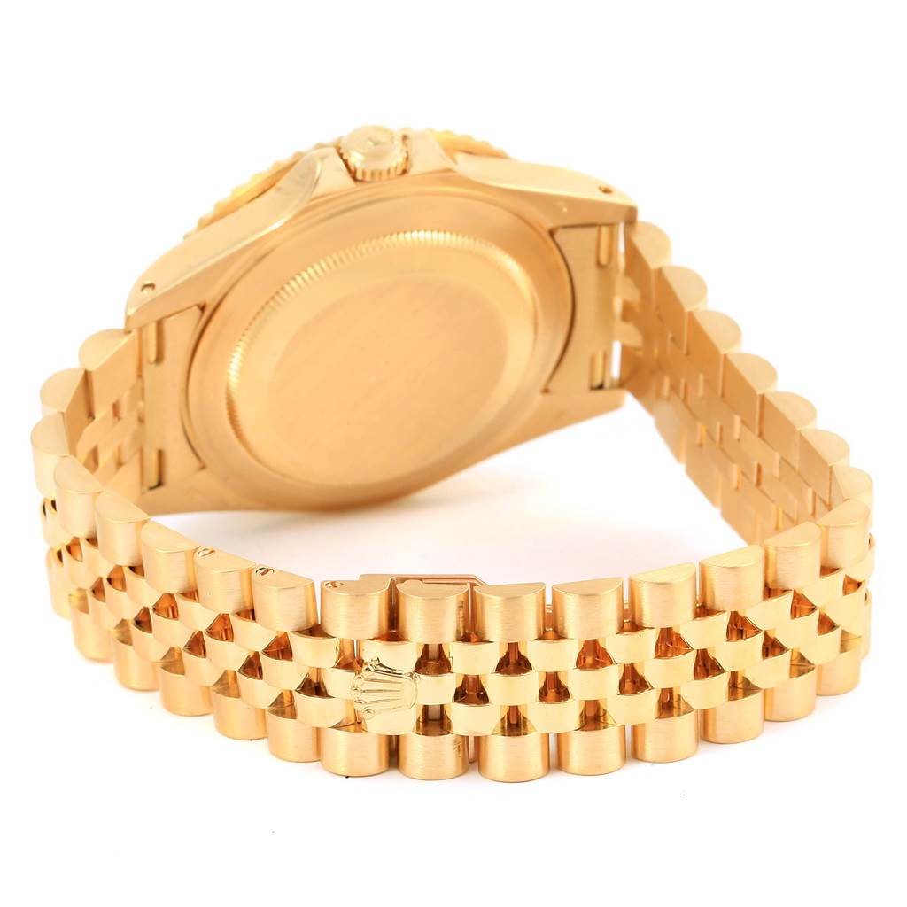 This image shows the back case and bracelet of a Rolex GMT-Master 16718 Men's Yellow Gold Brown Dial 16718 Men's Yellow Gold Brown Dial watch, displayed at an angle highlighting the clasp and links.