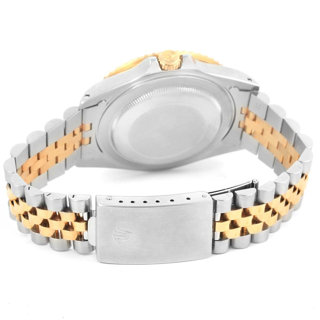 The image shows the back view and bracelet of a Rolex GMT-Master 16713 Men's Stainless Steel Black Dial 16713 Men's Stainless Steel Black Dial, featuring a combination of metal and gold links.