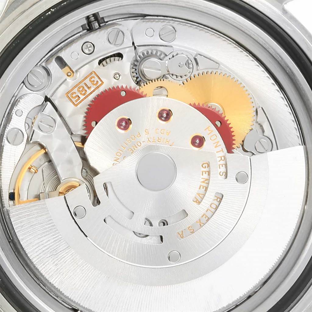 This image shows the movement of a Rolex GMT-Master 16710 Men's Stainless Steel Black Dial 16710 Men's Stainless Steel Black Dial watch viewed from the back, displaying its intricate gears and rotor.