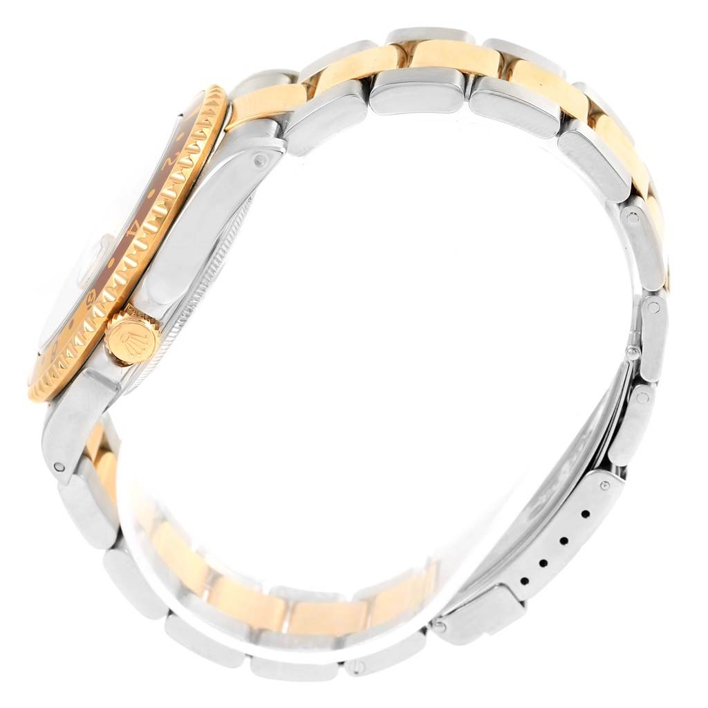 This image shows a side view of the Rolex GMT-Master 16713 Men's Stainless Steel Grey Dial 16713 Men's Stainless Steel Grey Dial watch, displaying its bezel, crown, and two-tone bracelet.