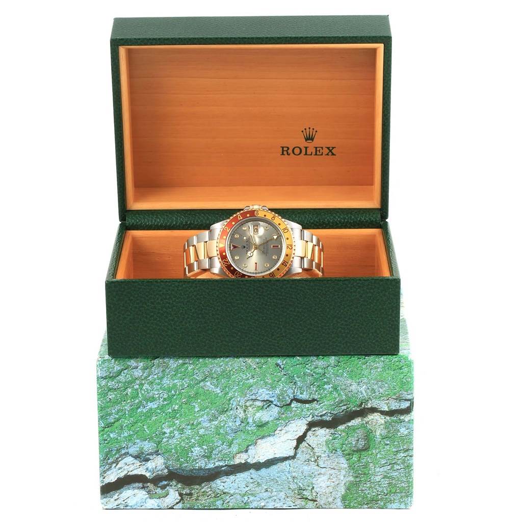 This image shows a Rolex GMT-Master 16713 Men's Stainless Steel Grey Dial 16713 Men's Stainless Steel Grey Dial watch positioned inside an open green watch box, viewed from the front.