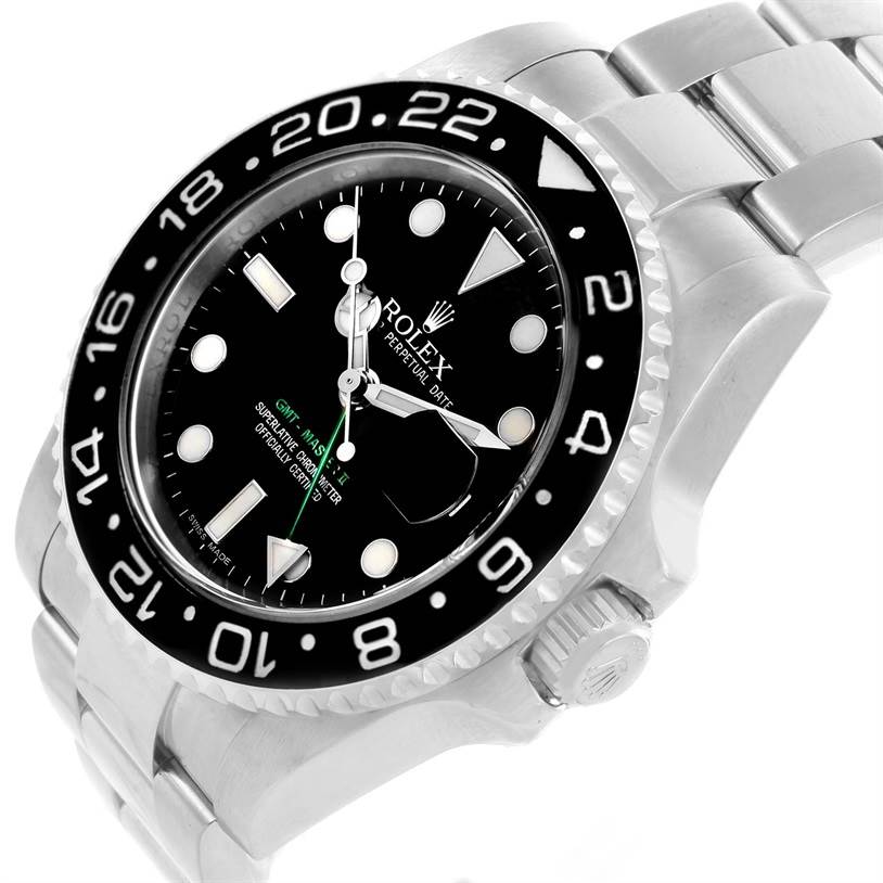 The image shows a Rolex GMT-Master 116710 Men's Stainless Steel Black Dial 116710 Men's Stainless Steel Black Dial watch from a tilted top-down angle, highlighting its bezel, dial, and part of the bracelet.
