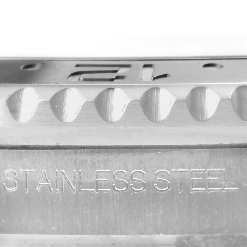 This image shows a close-up side view of the bezel and case side of a Rolex GMT-Master 116710 Men's Stainless Steel Black Dial 116710 Men's Stainless Steel Black Dial watch, featuring its stainless steel material.