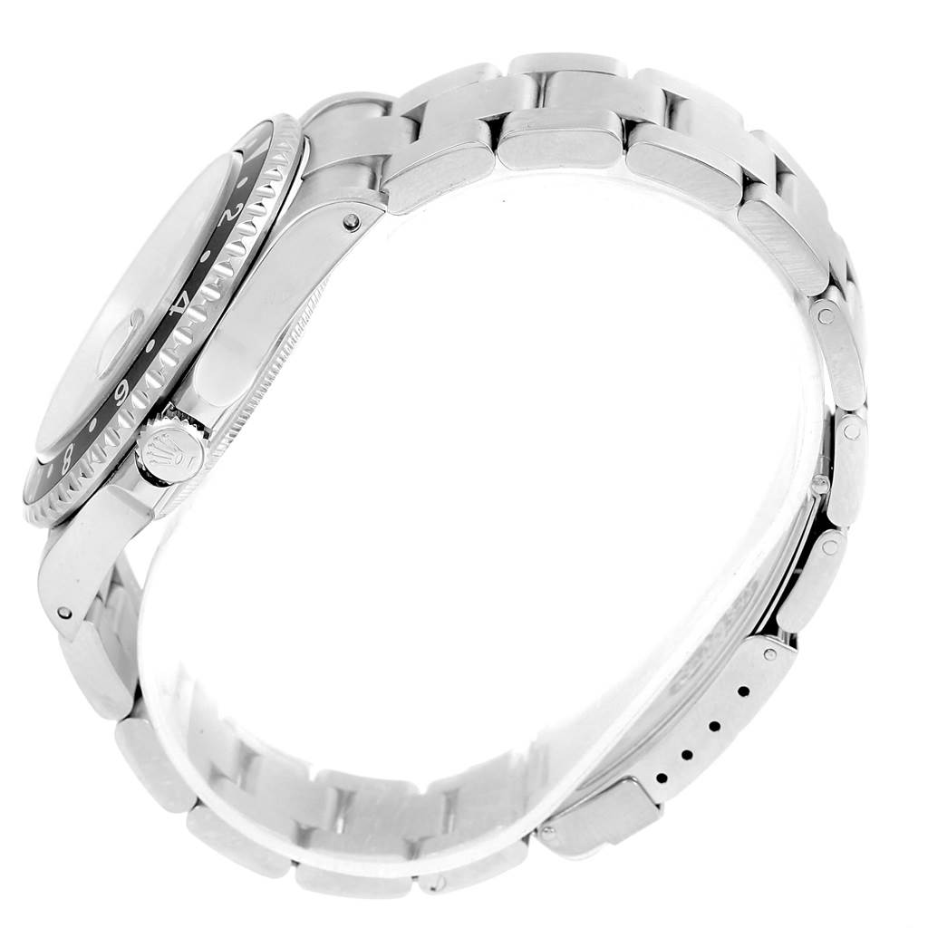 The image shows a side view of a Rolex GMT-Master 16710 Men's Stainless Steel Black Dial 16710 Men's Stainless Steel Black Dial watch, focusing on the bezel, crown, and bracelet.