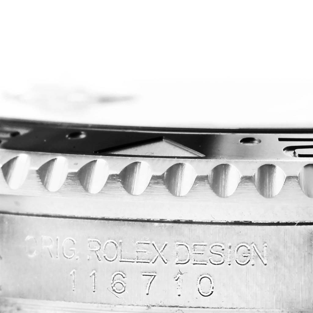 This image shows a close-up of the bezel and case side engraving of the Rolex GMT-Master 116710 Men
s Stainless Steel Black Dial 116710 Men
s Stainless Steel Black Dial watch.