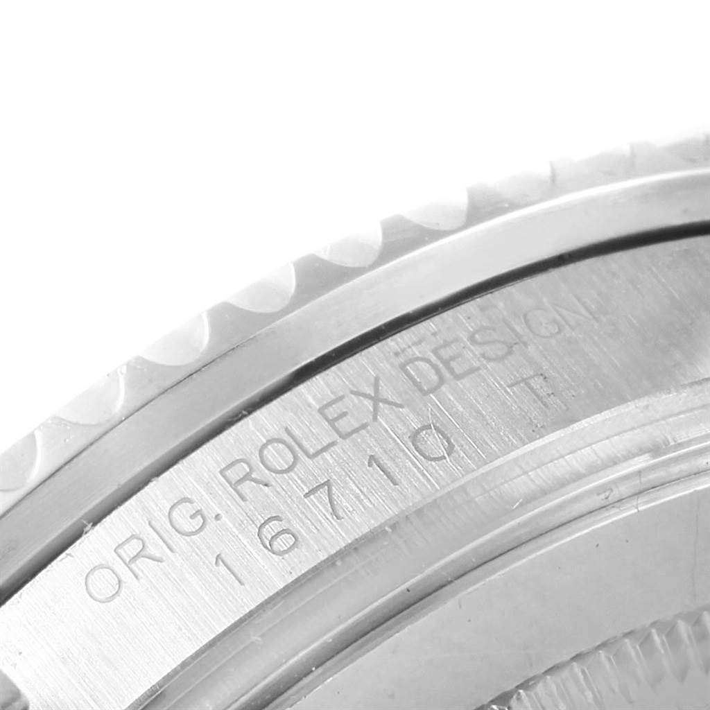 This close-up image shows the engraved side of the bezel and case back of a Rolex GMT-Master 16710 Men
s Stainless Steel Black Dial 16710 Men
s Stainless Steel Black Dial watch.